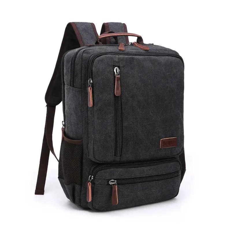 Vintage canvas backpack for men in dark gray with brown zipper pulls and multiple compartments.