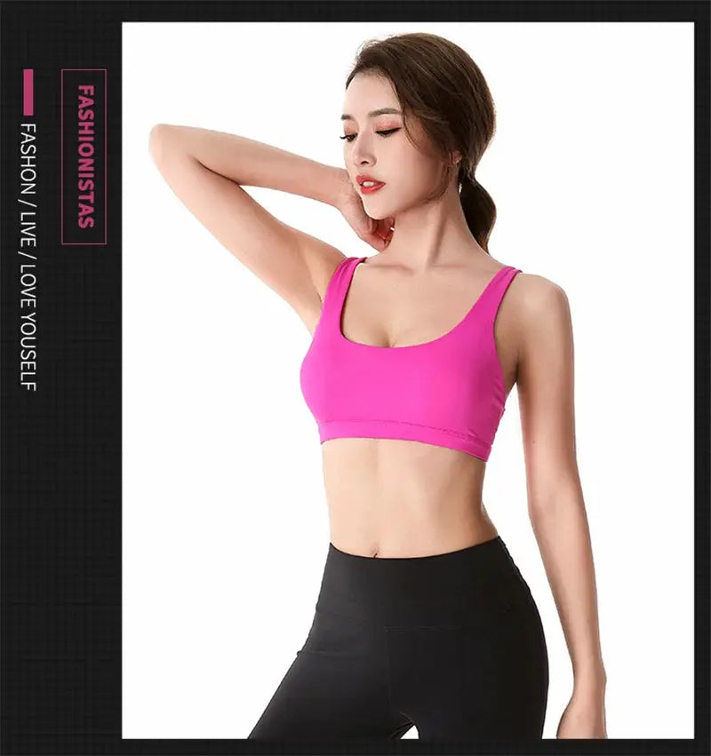 Women's pink cross-back fitness sports bra cropped top for gym workouts