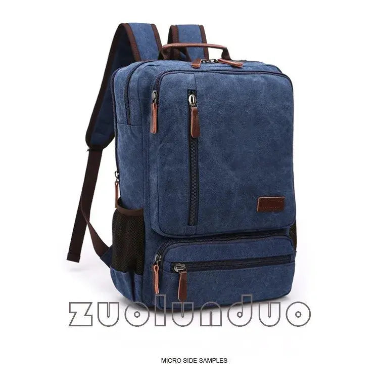 Vintage blue canvas backpack by Simples Market with laptop compartment and multiple zipper pockets.