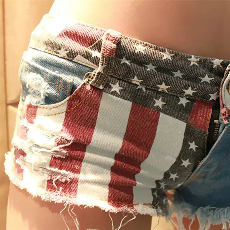 Mid waist USA flag printed denim shorts with distressed hems by Simples Market