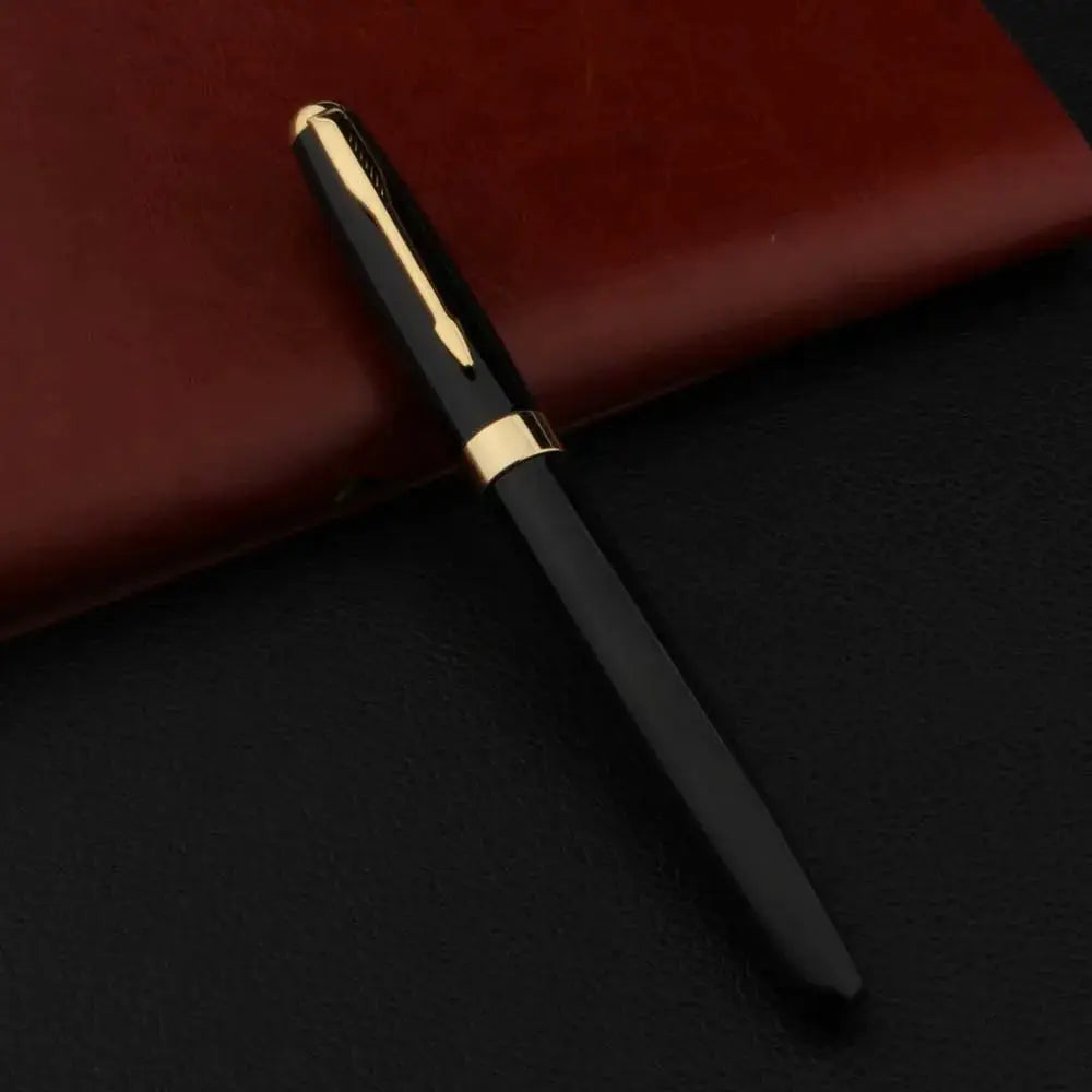 Fountain pen, black metal body with gold cap and band