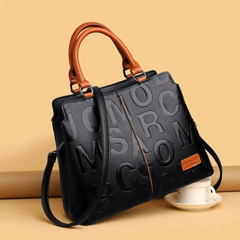 Simples Market PU leather crossbody bag for women, black with embossed letter pattern and brown top handles
