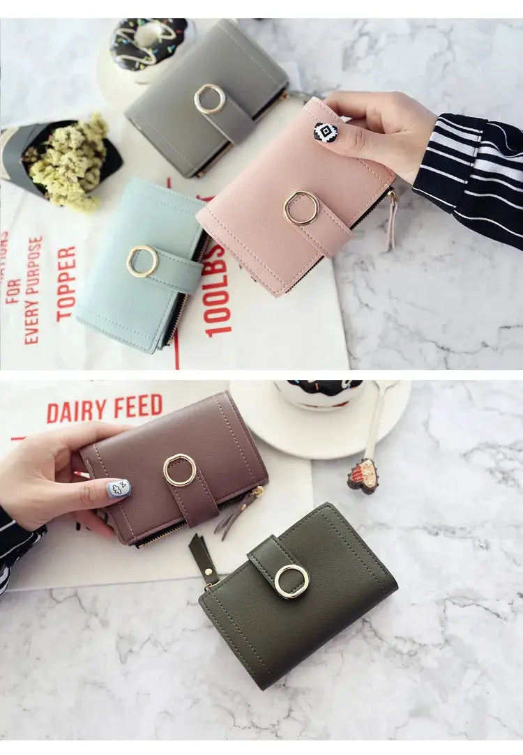 Simples Market women's PU zipper wallet; five compact wallets in pink, blue, gray, brown, olive with ring hardware.