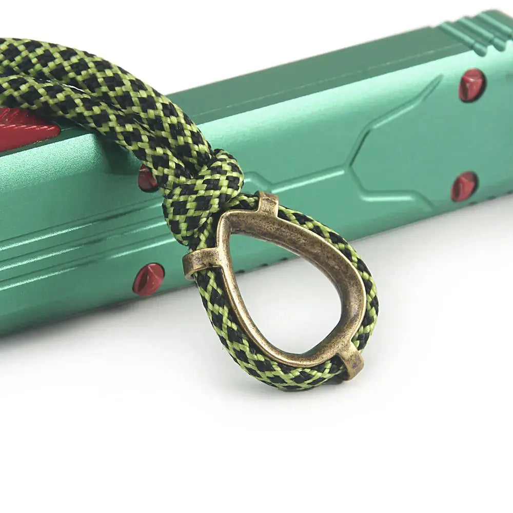 Paracord keychain with brass ring on green and black braided cord, Simples Market
