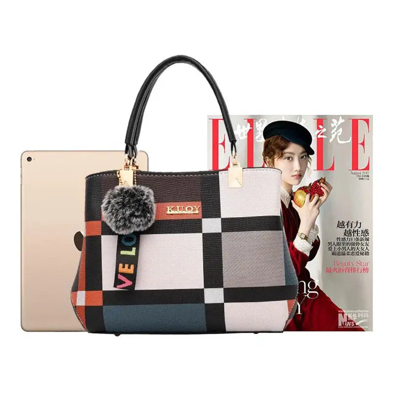 Simples Market PU leather designer handbag with color-block geometric pattern, top-handle, and fluffy pom-pom