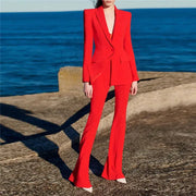 Women's red blazer suit set by Simples Market with a single-button blazer and flared pants.
