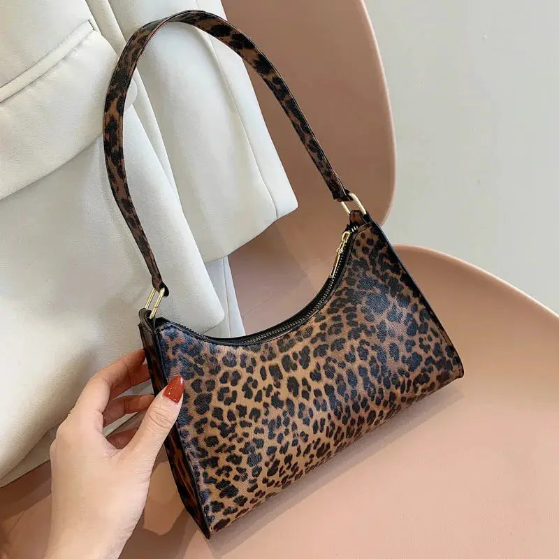 Shoulder bag by Simples Market in leopard print PU leather with gold hardware