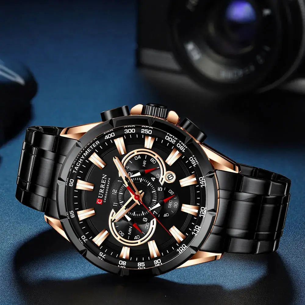 CURREN men's chronograph watch with black dial, rose-gold bezel, stainless steel band and luminous hands.