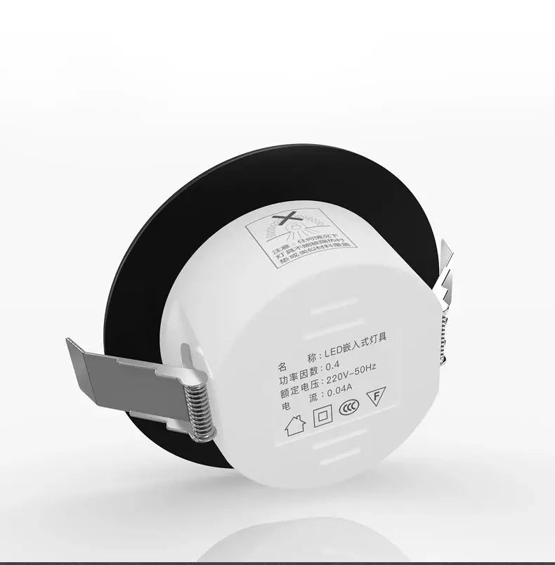 Simples Market chrome round recessed LED downlight with white housing and black bezel.