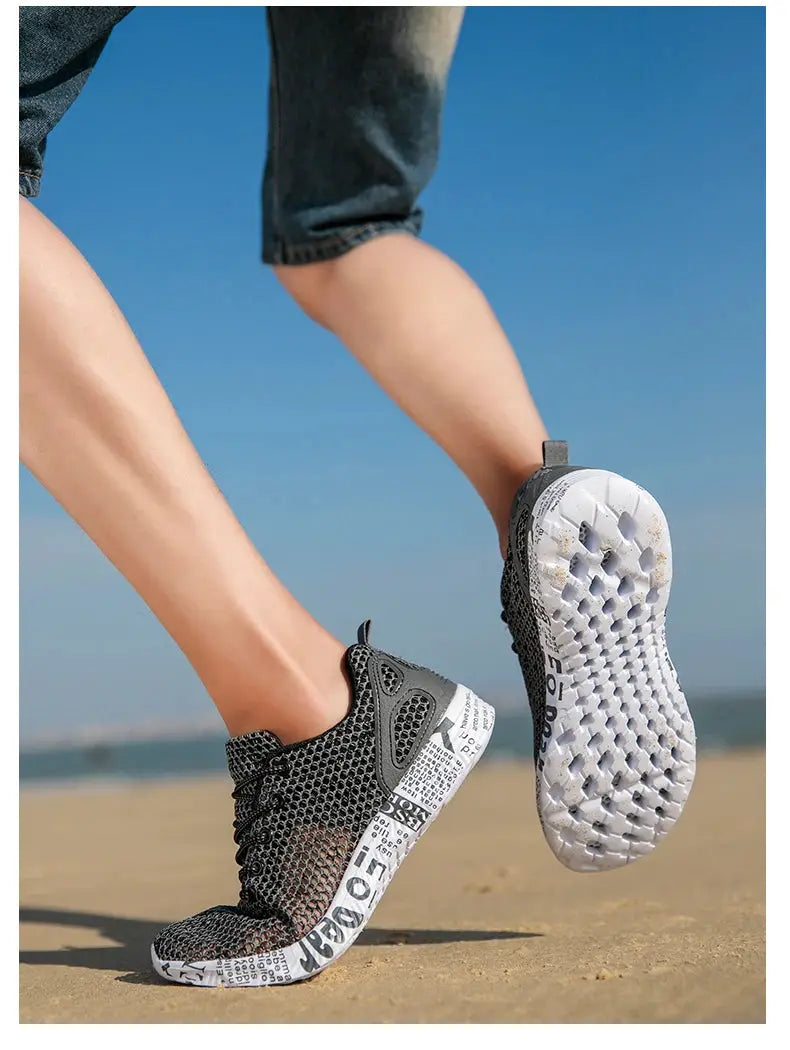 Simples Market men's aqua mesh water shoes with foam sole, pair shown on the beach.