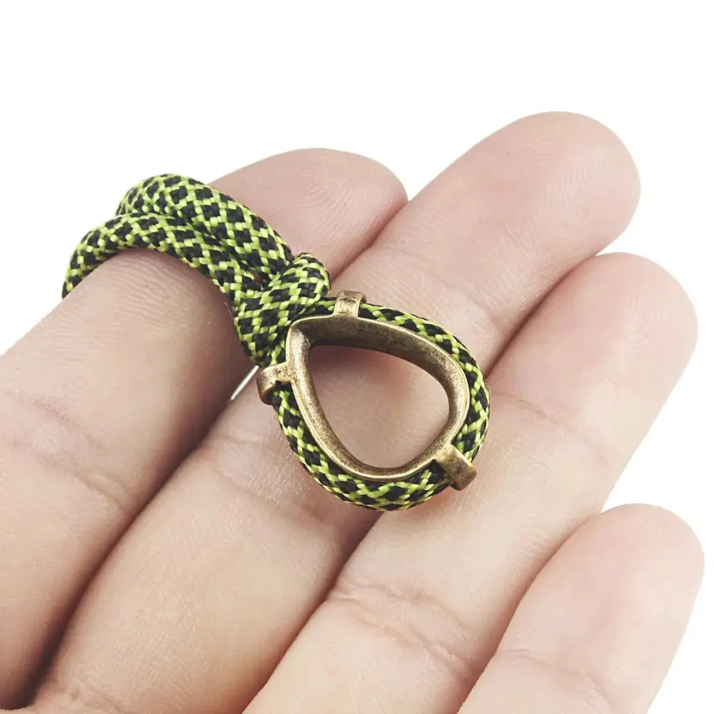 Paracord keychain with brass ring bead and neon green/black braided cord