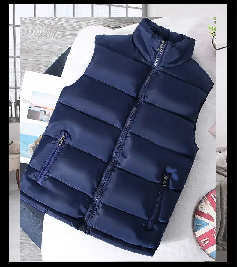 Navy blue sleeveless puffer vest with stand collar, front zipper and two zippered pockets