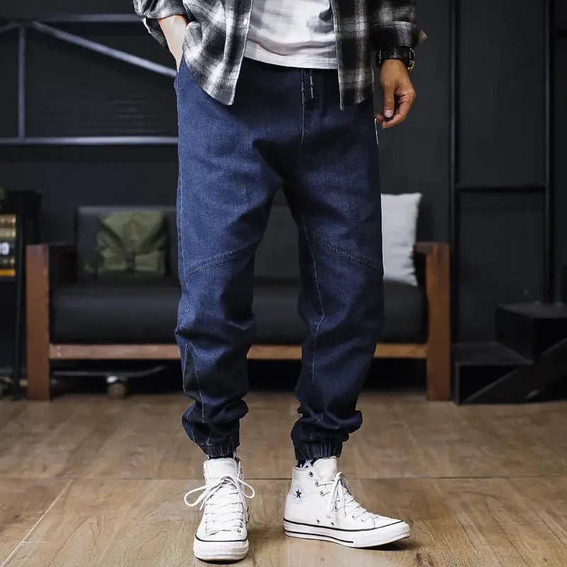 Plus-size men's denim jogger jeans, loose fit, ankle-length, dark indigo with elastic cuffs, Simples Market