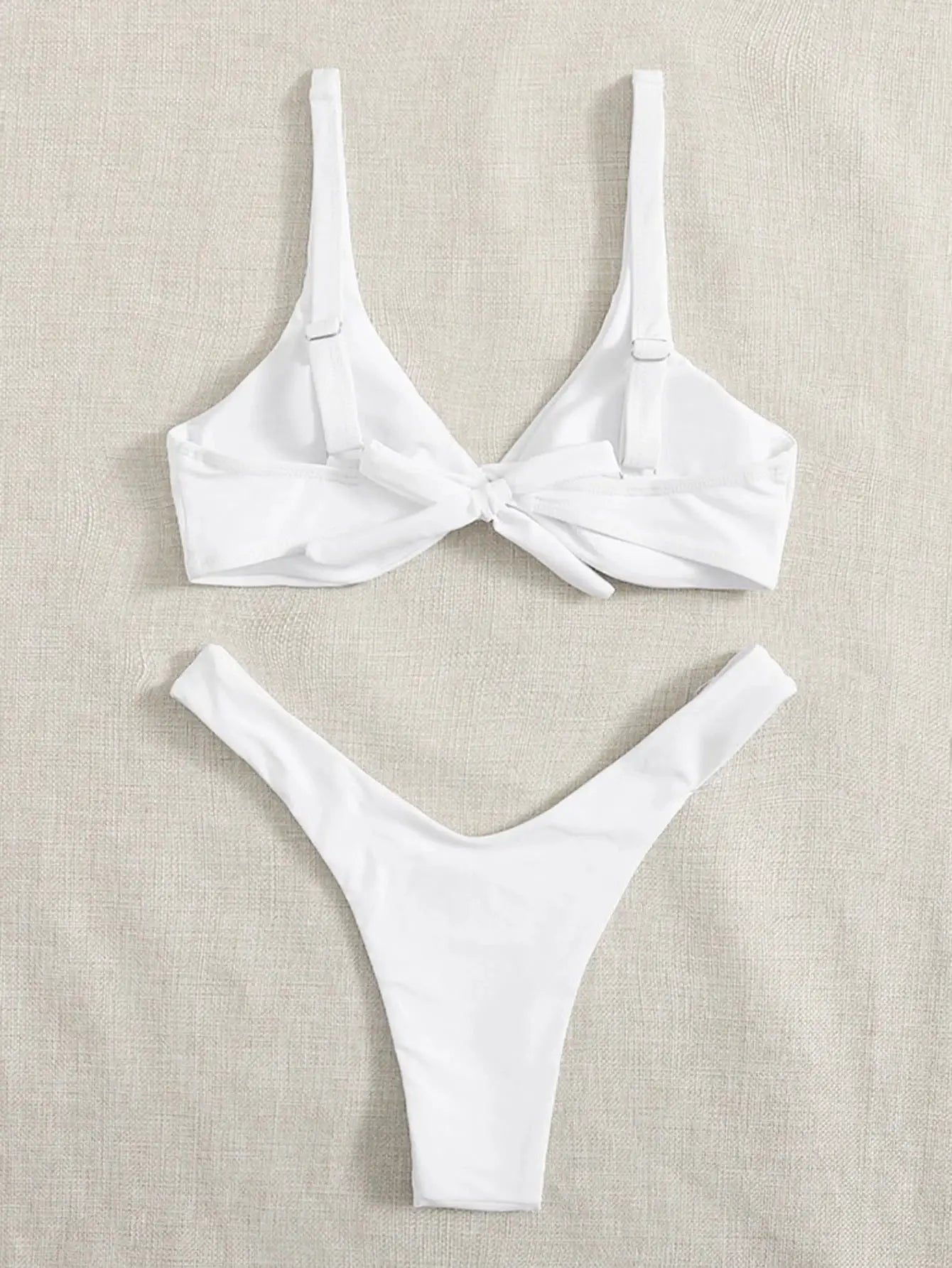 White ZTVitality two-piece bikini set with front-tie padded top and high-leg bottom by Simples Market