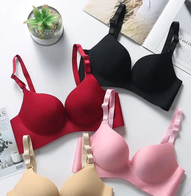 Simples Market four-pack wireless seamless push-up bras in black, red, pink, and nude.