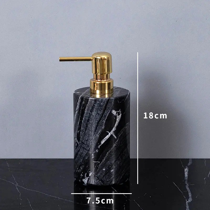 Soap dispenser in black marble with a gold pump; 18 cm tall and 7.5 cm wide base