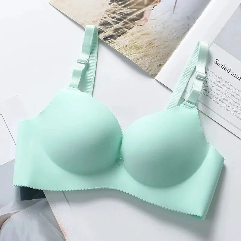 Push-up bra in mint green, seamless with padded cups and adjustable straps
