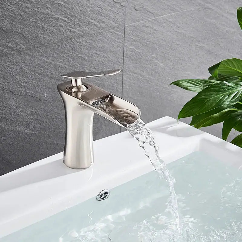 Basin faucet with single-handle waterfall spout in silver finish for bathroom sink
