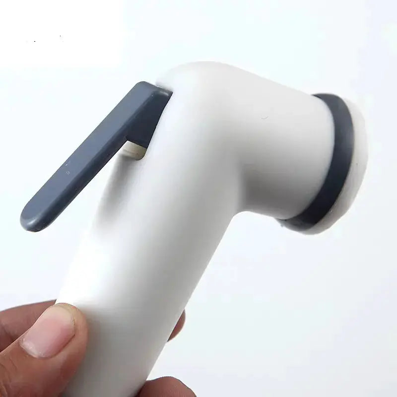 Handheld toilet bidet faucet with adjustable gray lever and white ABS body