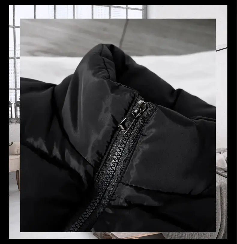Black puffer vest with stand collar and front zipper closure
