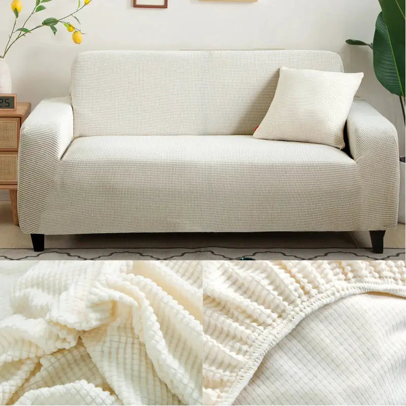 Sofa protector in cream jacquard by Simples Market; L-shaped corner sofa cover with ribbed texture.