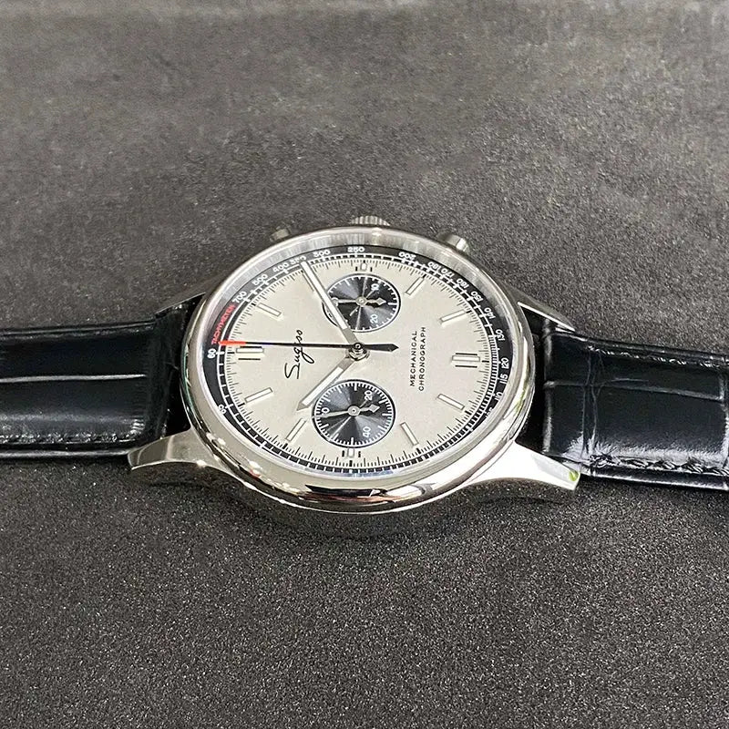 Panda chronograph watch with white dial, black subdials, stainless steel case, and black leather strap