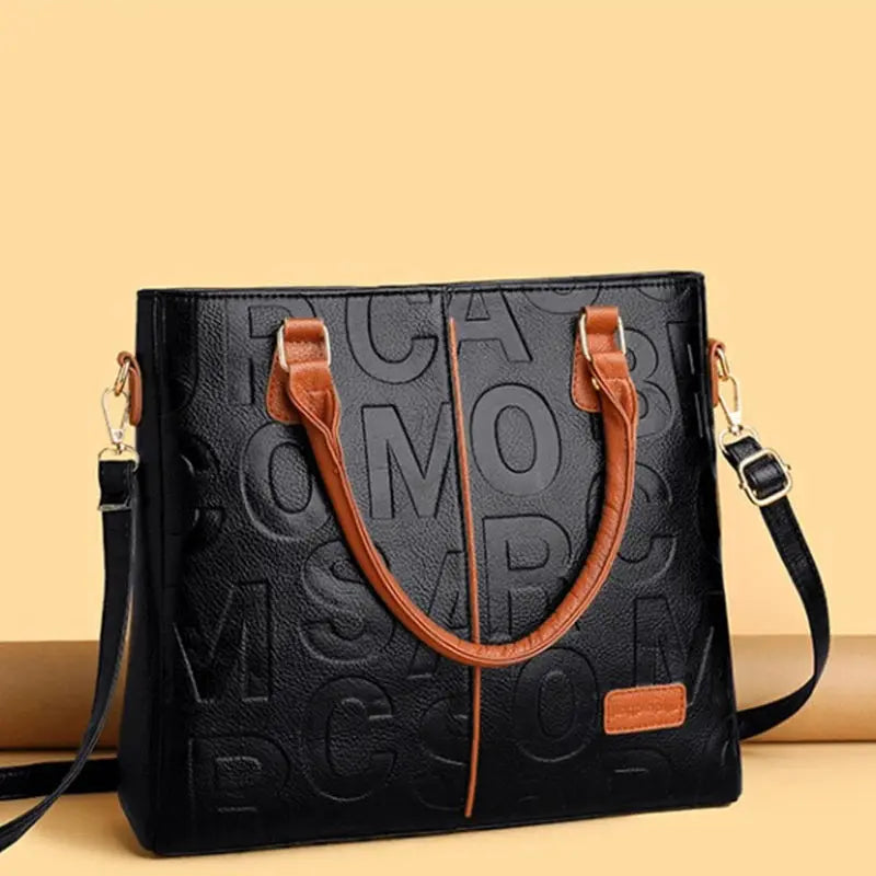 PU Leather Crossbody Tote Bag by Simples Market, black embossed pattern with tan handles, large capacity
