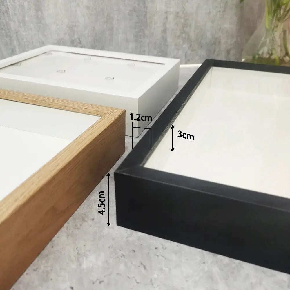 Shadow box three-frame set; Simples Market wooden frames in white, natural wood, and black with 3 cm depth.