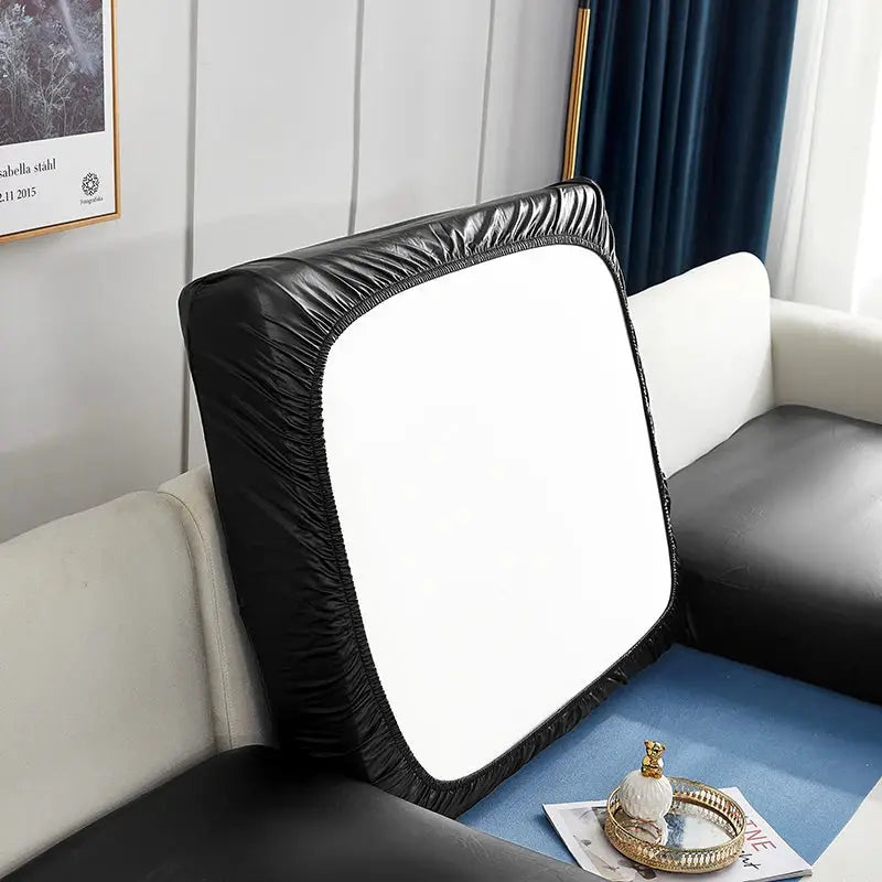 Corner sofa slipcover in black PU with white center panel and elastic edges