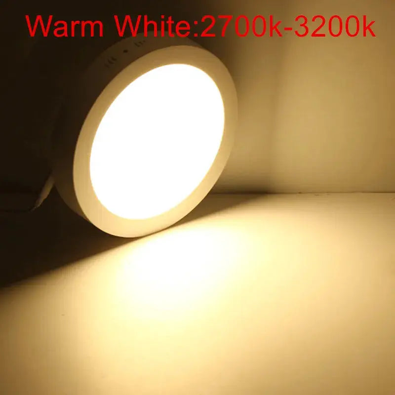 Round LED panel downlight in white finish emitting warm white light (2700–3200K)