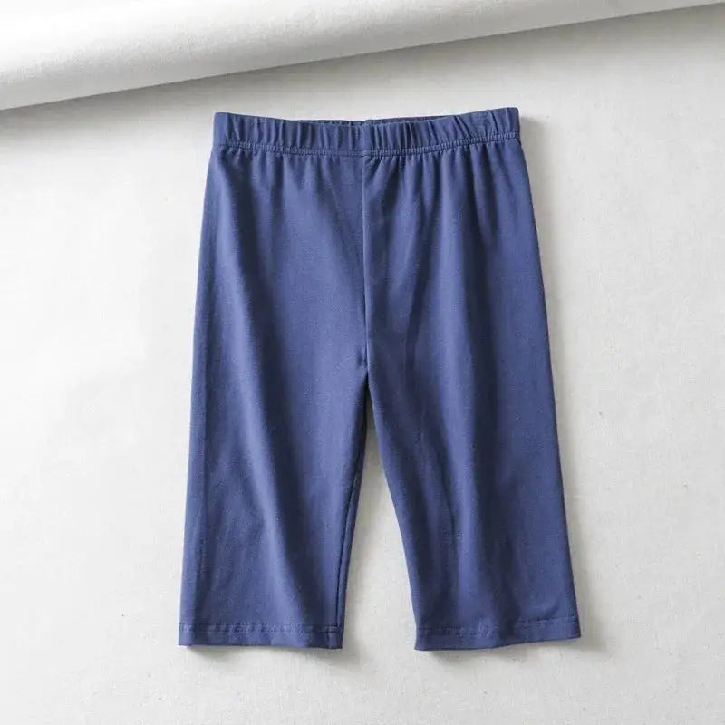 Women's knee-length blue high-waist biker shorts by Simples Market with elastic waistband.