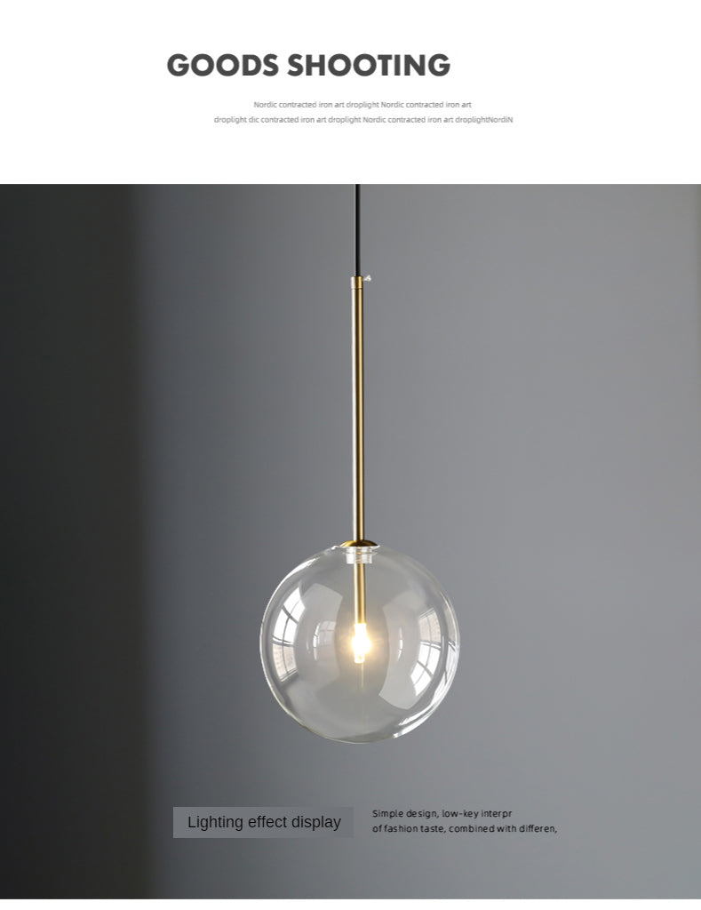 Modern LED pendant lamp with clear glass ball, gold suspension rod for bedroom or living room.