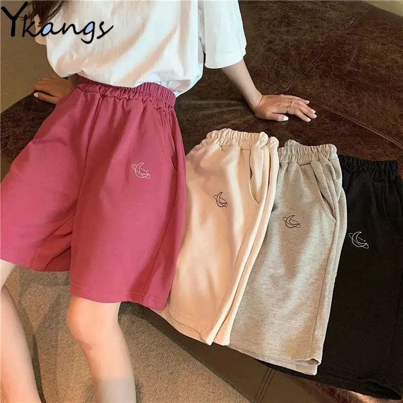 Women's casual shorts set in pink, beige, gray, and black with crescent moon embroidery