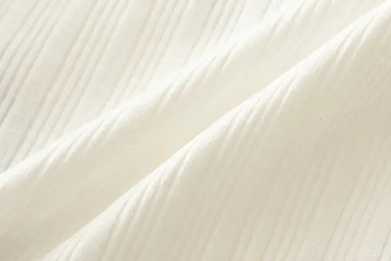 Cotton women's underwear fabric close-up in white; seamless weave texture.