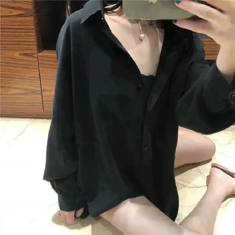 Zadily black oversized button-up shirt by Simples Market, long-sleeve tunic blouse with loose fit.