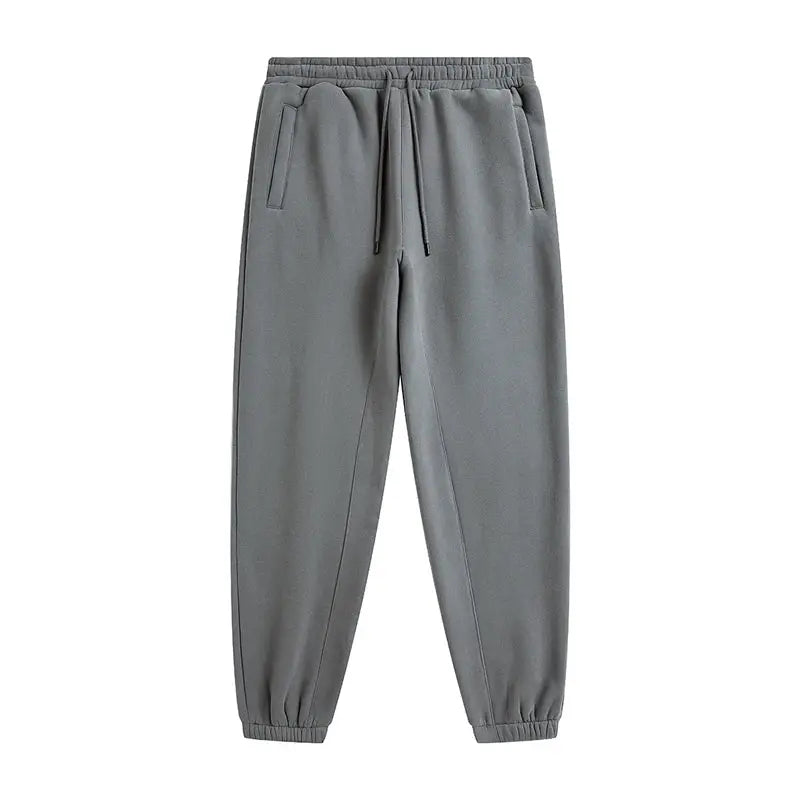 Grey fleece joggers with drawstring waist and elastic cuffs, side pockets, unisex
