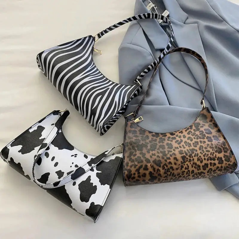 Shoulder bags set for women: three PU leather handbags in zebra, cow print, and leopard patterns.