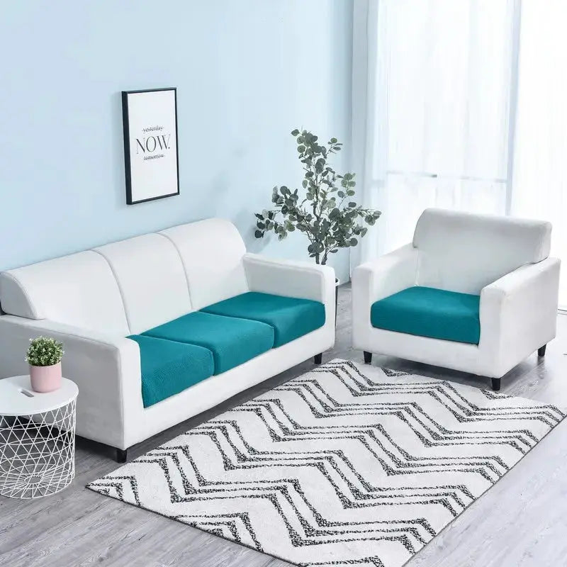 Sofa seat cushion covers by Simples Market in teal, removable washable slipcovers on white sofa and armchair.