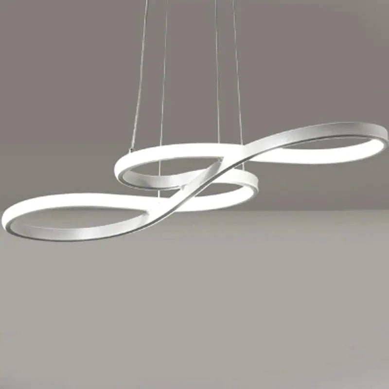 Modern kitchen island pendant lights with two interlocking circular LED rings, white metal, hanging cord suspension, remote dimming.