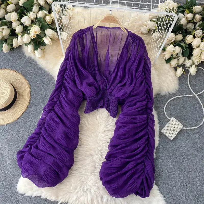 Draped chiffon blouse in purple with V-neck, puff long sleeves and cropped smocked waist