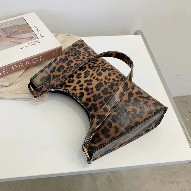Leopard print PU leather shoulder bag for women with curved silhouette