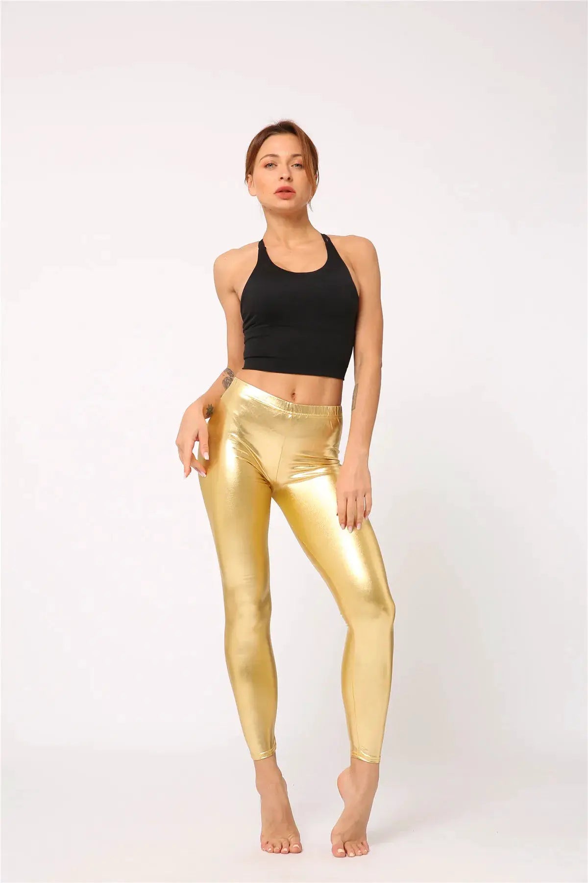 Ladies gold metallic laser-leather leggings candy color by Simples Market on model with black crop top