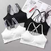 4-pack women's sports bras in black and white with high-impact support and strappy-back designs