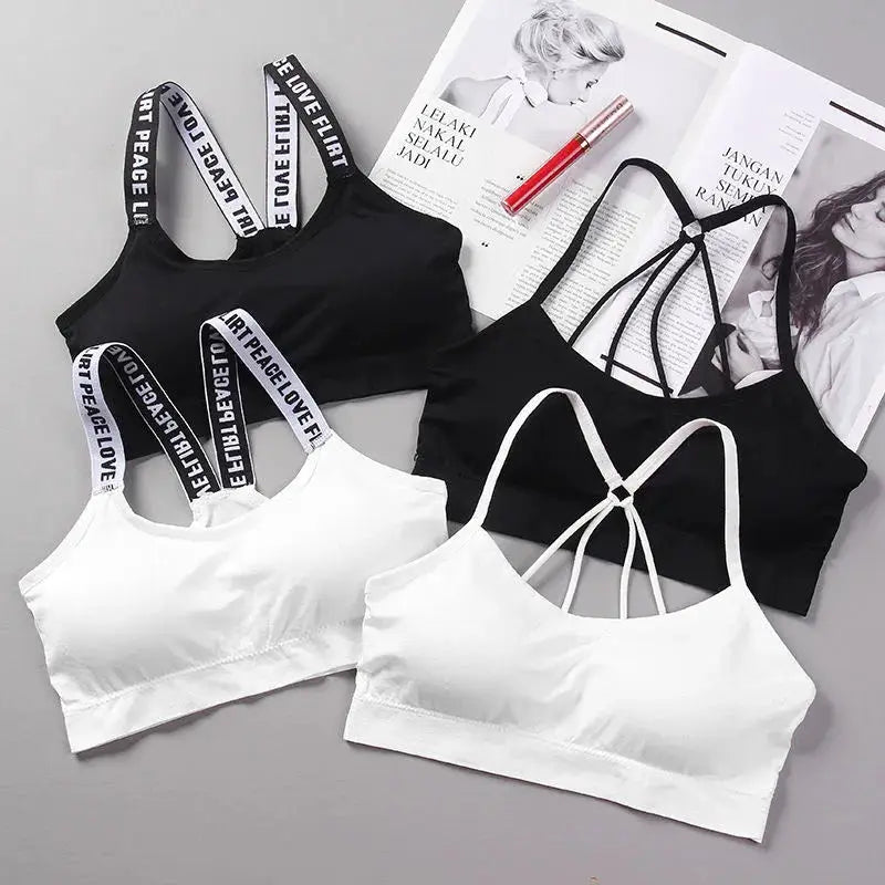 4-pack women's sports bras in black and white with high-impact support and strappy-back designs
