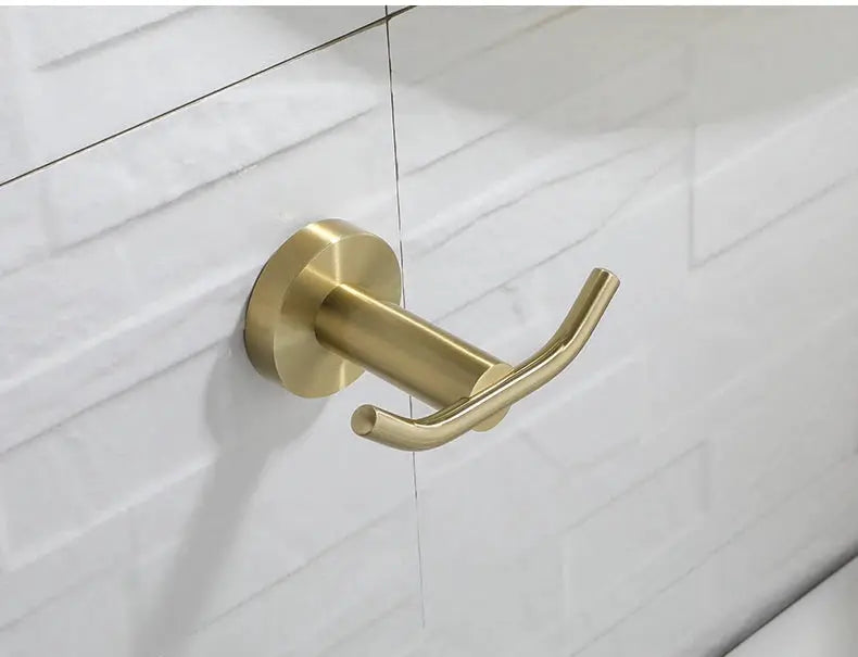 Robe hook in brushed gold, wall-mounted bathroom hardware