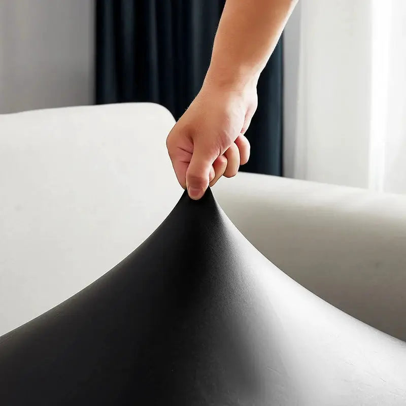 Simples Market PU sofa cover in black, waterproof easy-clean corner slipcover being stretched
