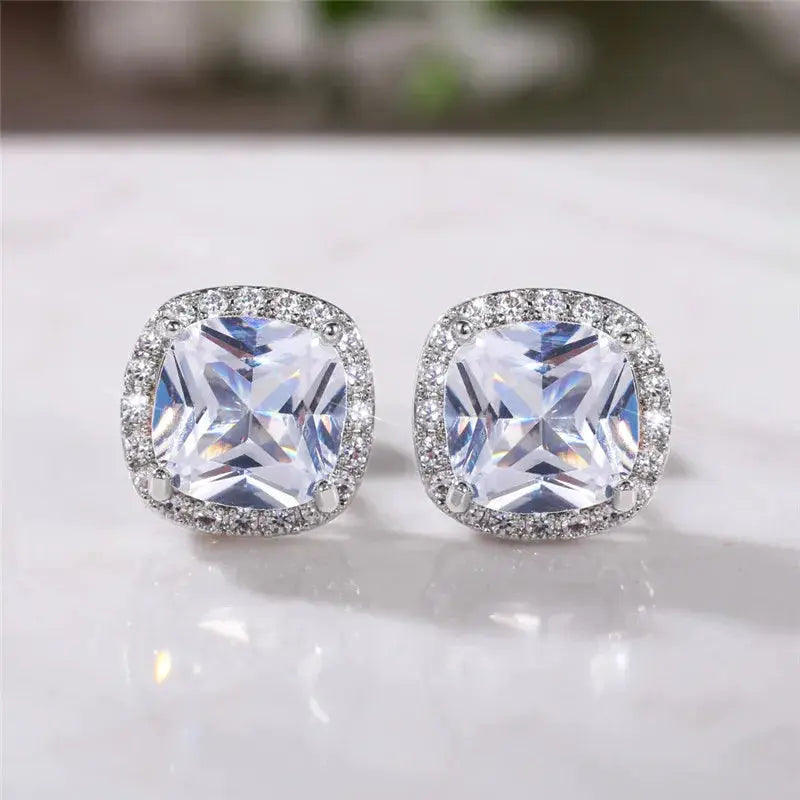 Huitan cushion-cut cubic zirconia stud earrings by Simples Market, silver-tone halo with pavé crystals, pair