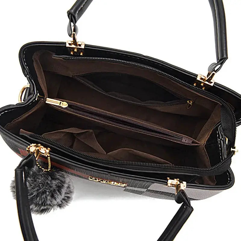 Simples Market black PU leather handbag with gold hardware, top zipper, brown interior, crossbody strap