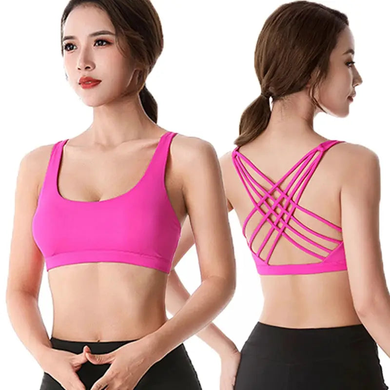 Pink crop-top sports bra for women with cross-back straps, ideal for gym, running and yoga.