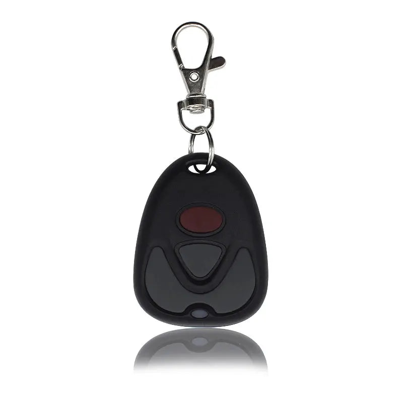 Garage door remote control, black with red button and gray panel, 433MHz, on a metal keyring clip.